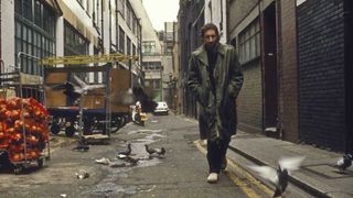 Pete Townshend walking in a London alleyway in 1980