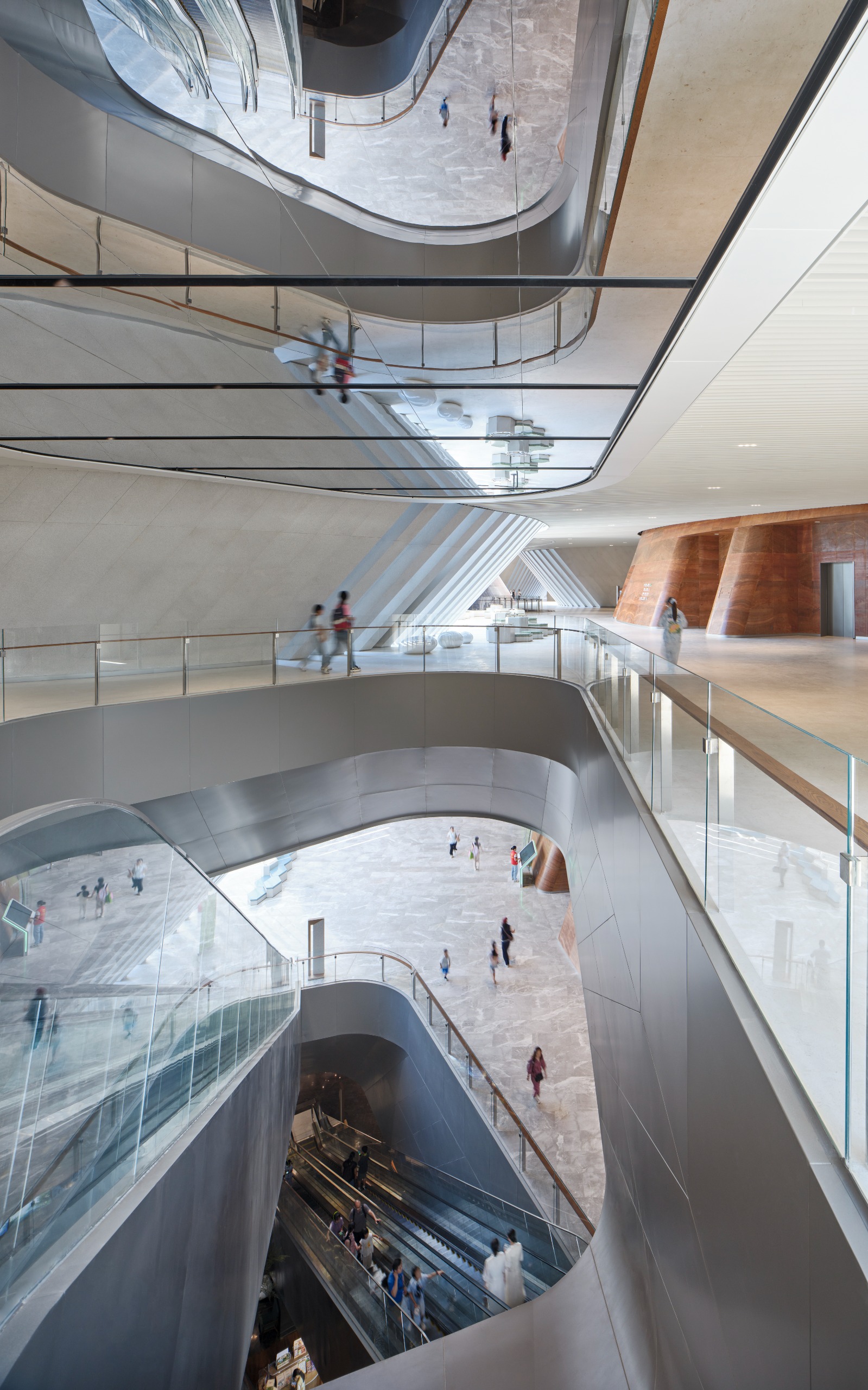 undulating forms of the Shenzhen Natural History Museum by 3XN, B+H Architects and Zhubo Design in a green park