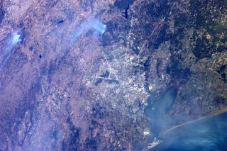 This photo of Texas wildfires from space was taken by astronaut Ron Garan.