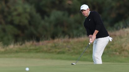 Rory McIlroy hitting an uphill putt