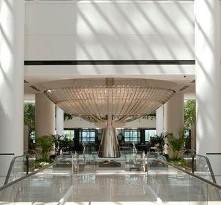 Renaissance Schaumburg Hotel, Convention Center and Performing Arts Center, Illinois lobby, 2006 with fireplace sculpture Warmth by John Portman.