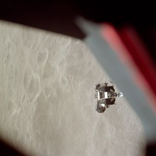 The Apollo 10 lunar module Snoopy approaches the command module Charlie Brown before docking in lunar orbit.