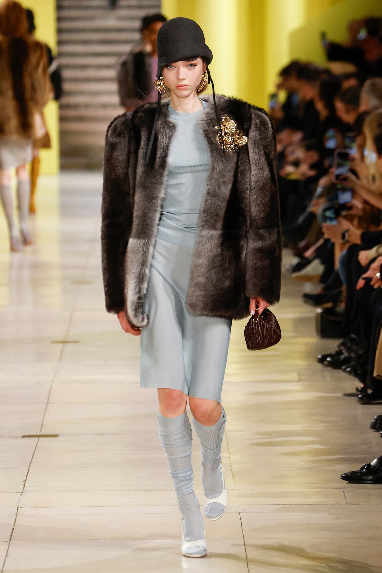 Model wears the baby blue color trend on the runway.