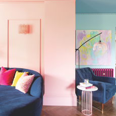 pink and blue double drenched room. Blue chairs, hot pink radiator and drenched walls