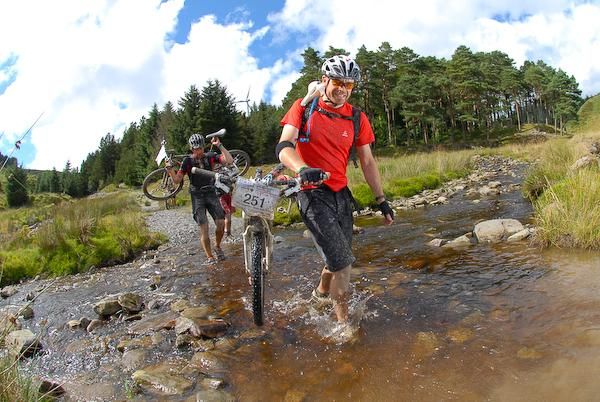 Riders cross a stream during day 4 of the TransWales