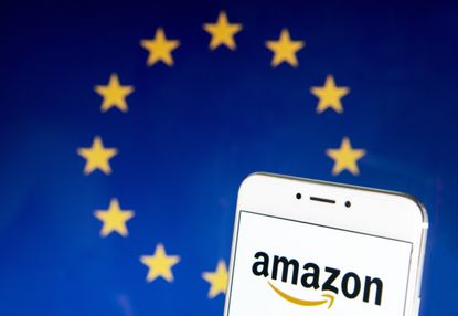 HONG KONG - 2019/04/21: In this photo illustration a American electronic commerce and cloud computing company Amazon logo is seen on an Android mobile device with the European Union flag in t
