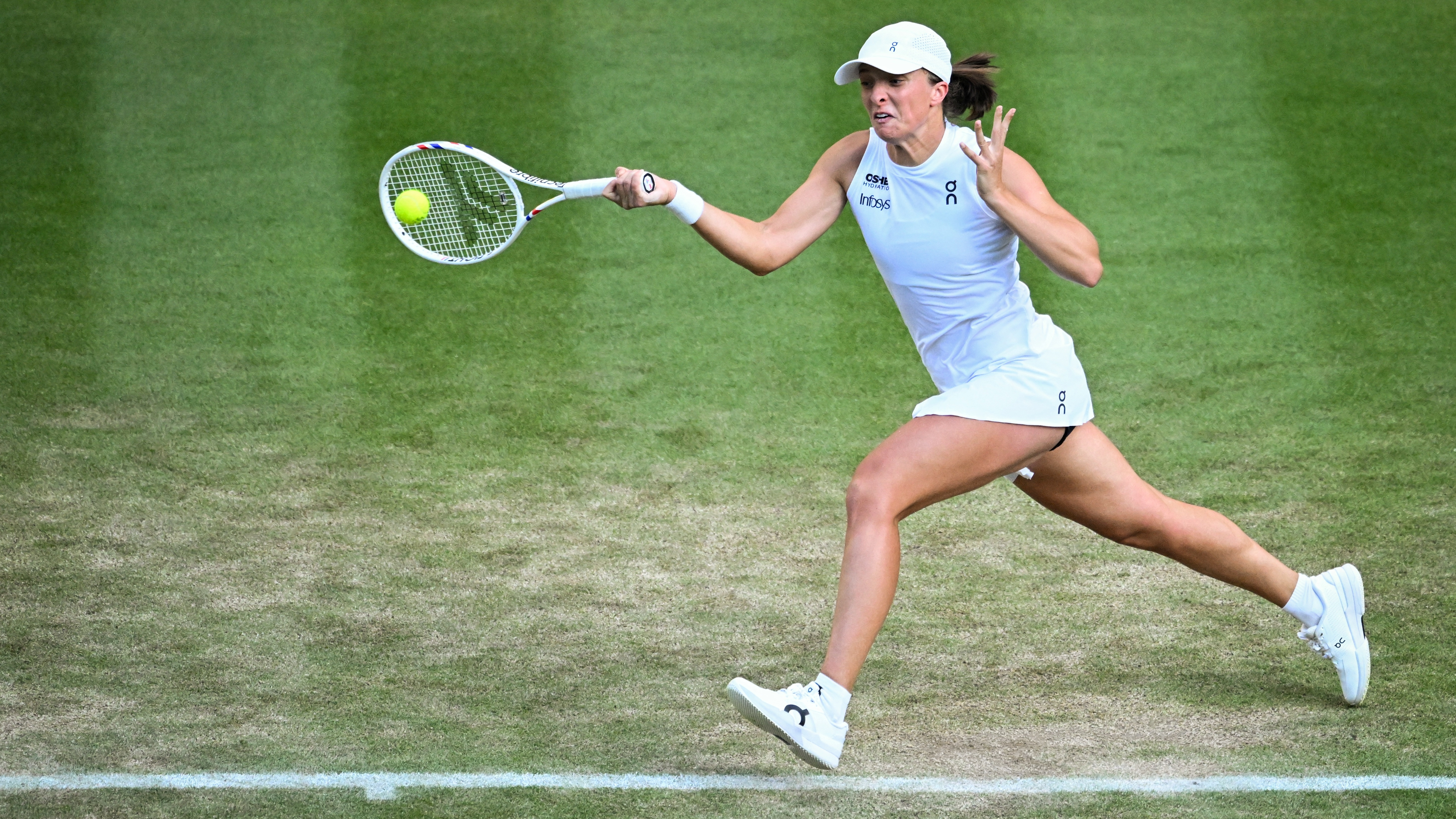 Iga Swiatek playing at Wimbledon 2025