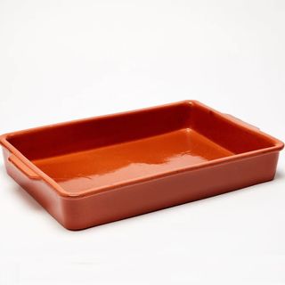 A red clay baking dish