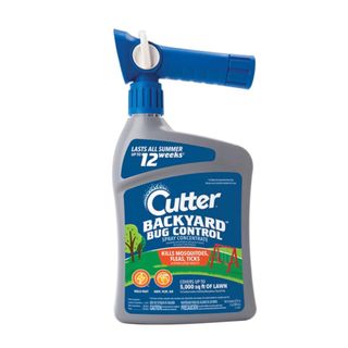 A dark blue and gray spray bottle with the words 'Cutter backyard bug control' on it in white font, with an illustration of a lawn and trees behind it