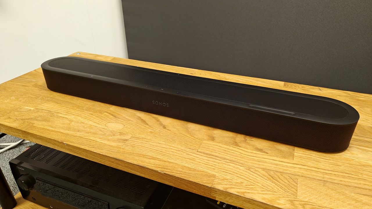 Sonos Beam Ultra soundbar on a wooden table