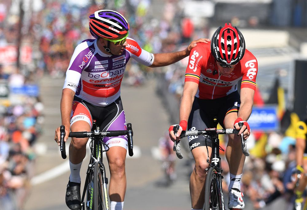 Gianni Vermeersch and Jurgen Roelandts cross the line following a large crash near the end of stage 1 at the Belgium Tour