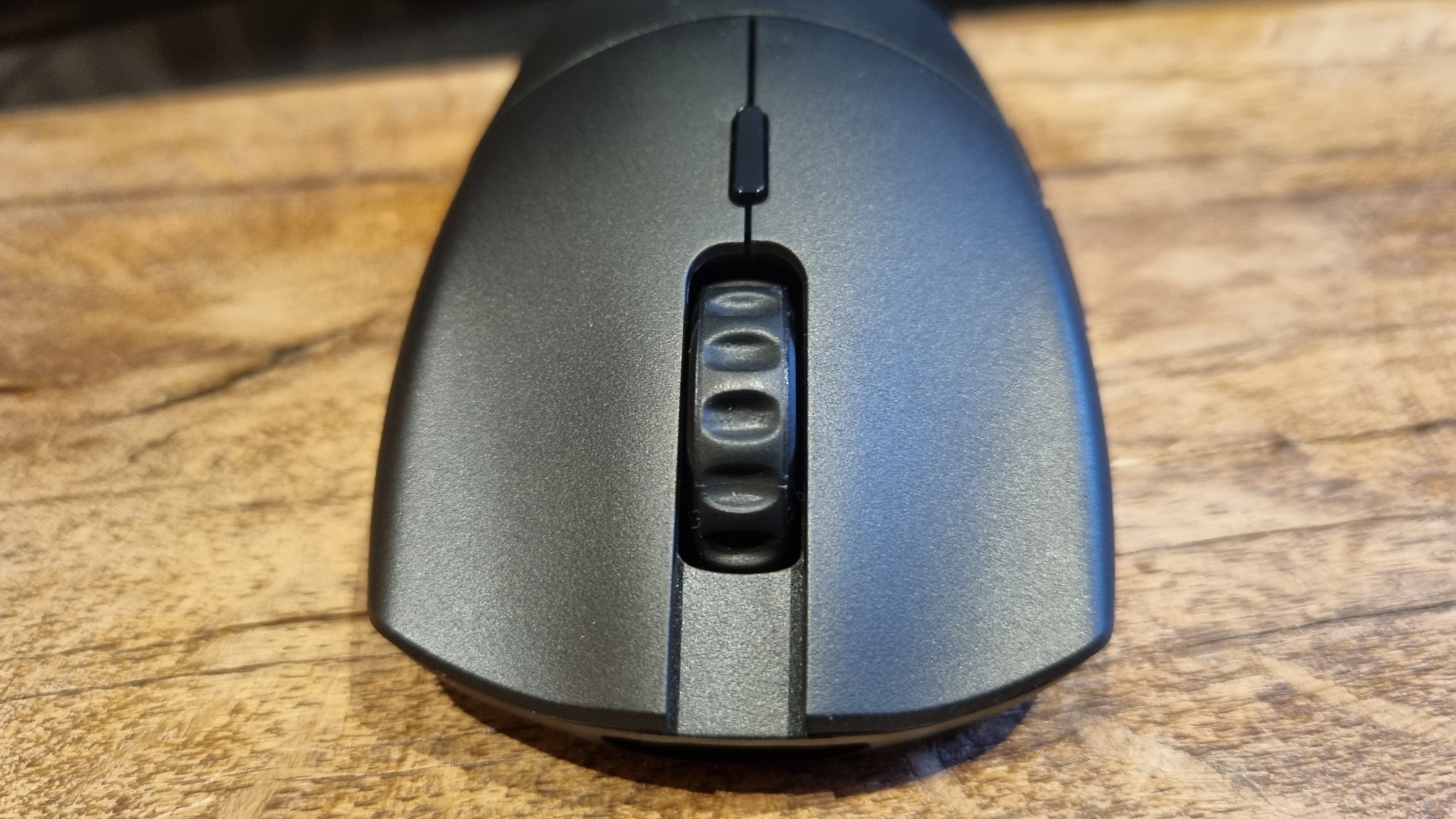 The Glorious Series 2 Pro gaming mouse on a wooden surface.