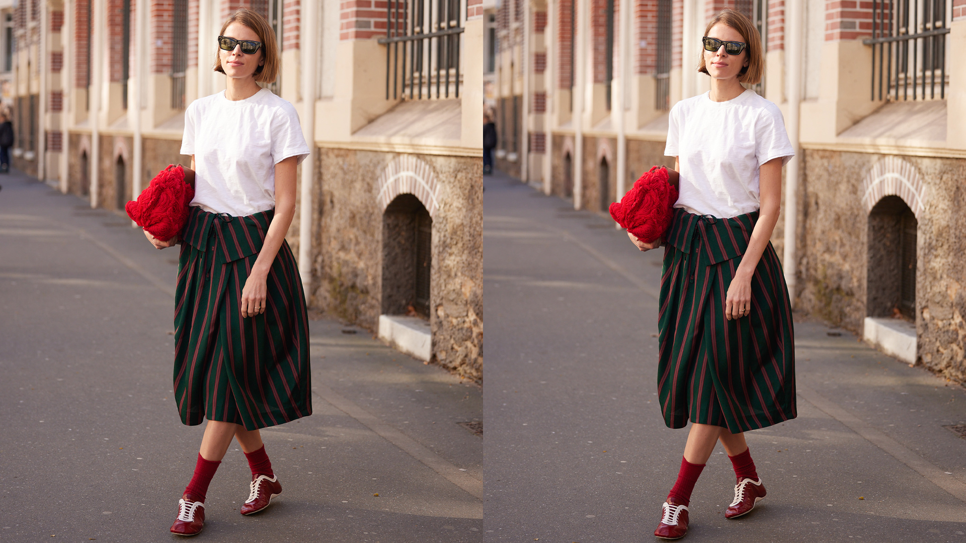 Woman wears cool skirt with fun striped pattern, red shoes, socks, and clutch with a white tee. 