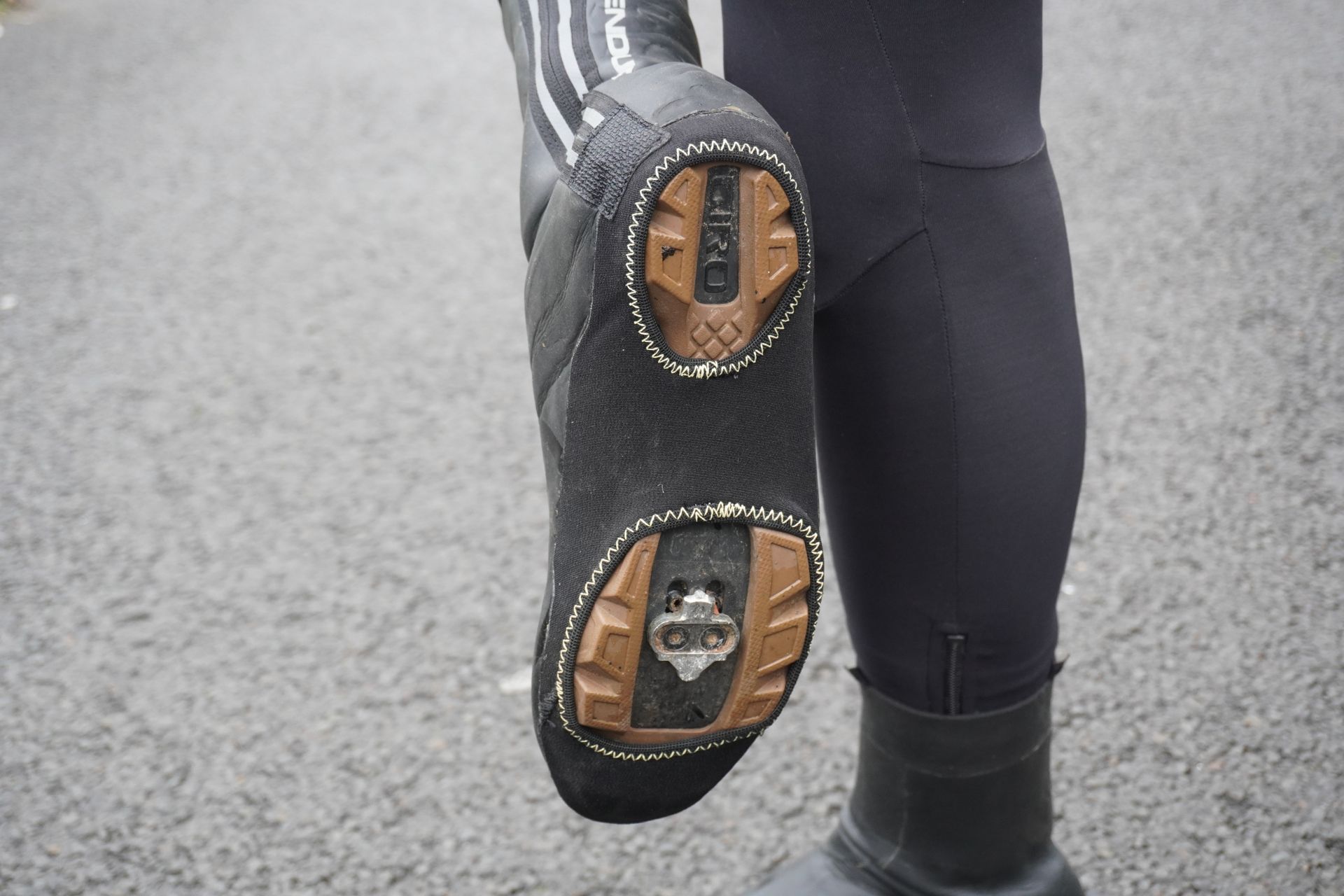 Image shows a rider wearing Endura's Freezing Point Overshoe IIs.