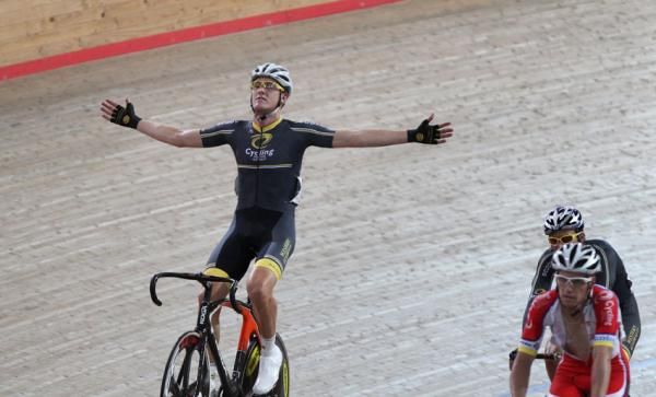 Luke Dubridge celebrates his win in the men's 40km points race after a nail-biting finish.