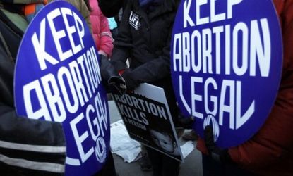 Pro-life and pro-choice activists during a March for Life in January: South Dakota legislators signed a "precedent-setting anti-abortion bill into law Tuesday.