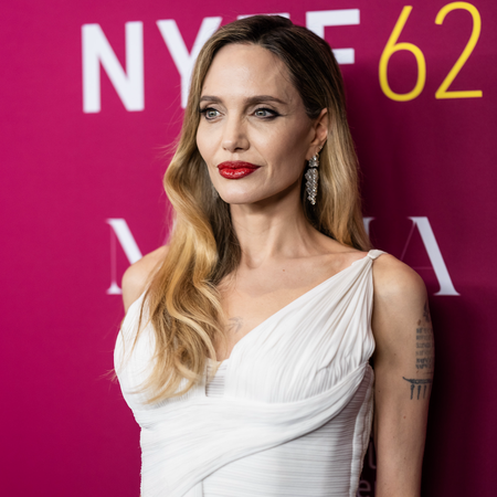 Angelina Jolie attends the "Maria" screening during the 62nd New York Film Festival at Alice Tully Hall, Lincoln Center on September 29, 2024 in New York City wearing a white pleated dress