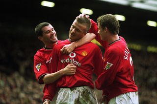 David Beckham celebrates with Roy Keane and OIe Gunnar Solskjaer after scoring a free-kick against Sunderland for Manchester United at Old Trafford in 2002.