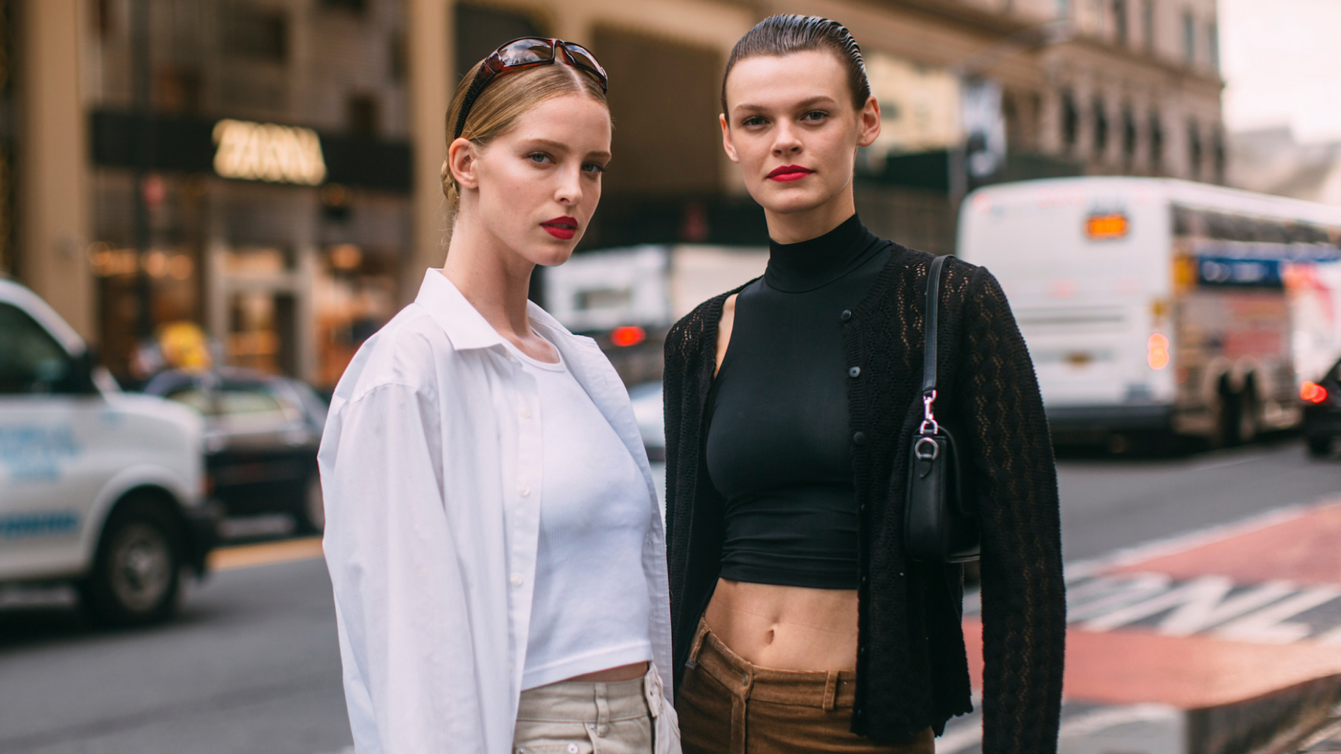 fashion week attendees wearing black and white tank tops and long sleeve tops with red lips