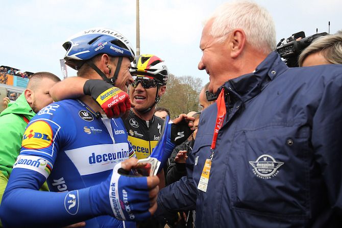 2019 Paris-Roubaix winner Philippe Gilbert, third-placed Yves Lampaert and Deceuninck-QuickStep manager Patrick Lefevere celebrate their victory