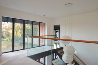 a staircase lighting idea with a cluster of pendant lights