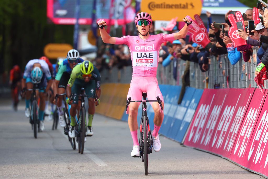 Team UAE's Slovenian rider Tadej Pogacar celebrates as he crosses the finish line to win the 8th stage of the 107th Giro d'Italia cycling race, 152km between Spoleto and Prati di Tivo, on May 11, 2024. (Photo by Luca Bettini / AFP)