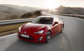 Red Toyota GT-86 on road