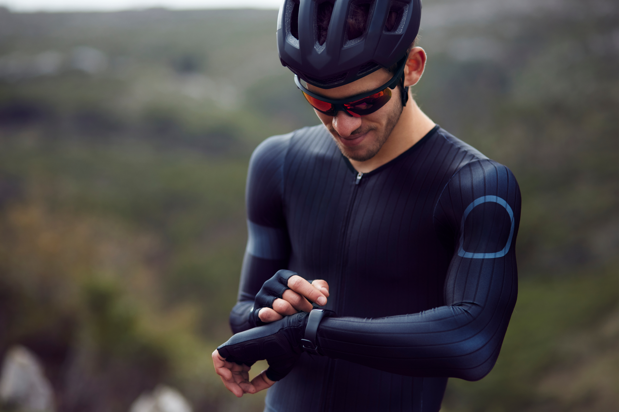 Image shows rider with a smartwatch