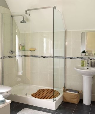 bathroom with tiles on wall and shower