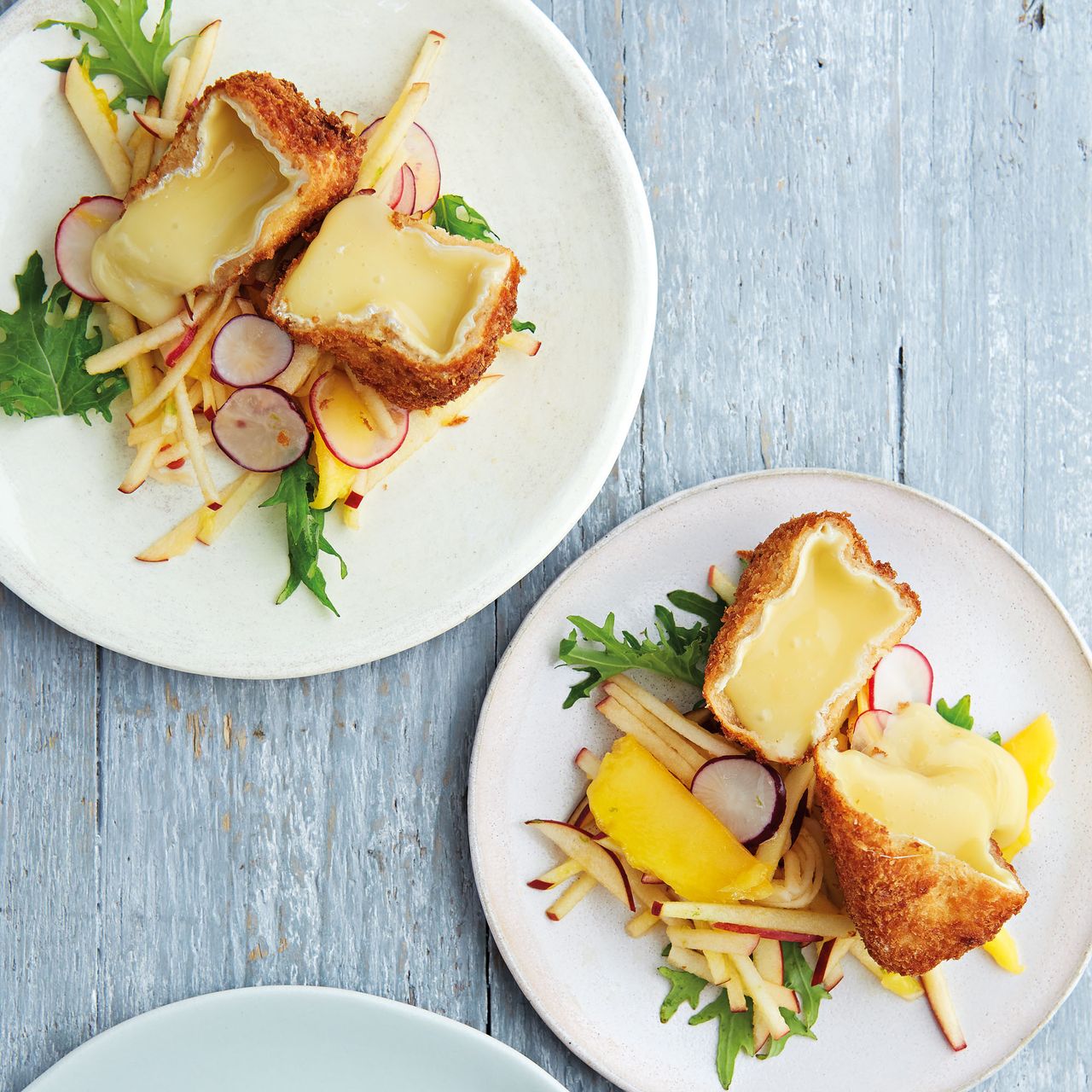 Crumbed camembert, apple, mango, salad leaves and radish