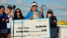 Amy Yang poses with the CME Group Tour Championship trophy