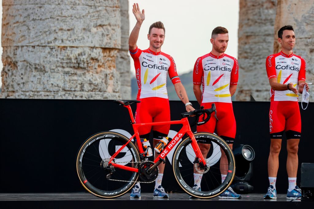 Italys Elia Viviani L of Cofidis Team waves on stage at the Doric Temple of Segesta near Palermo Sicily on October 1 2020 during an opening ceremony of presentation of participating teams and riders two days ahead of the departure of the Giro dItalia 2020 cycling race Photo by Luca Bettini AFP Photo by LUCA BETTINIAFP via Getty Images