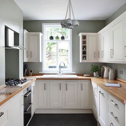 white wooden kitchen cabinet with sink