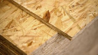 Close up of stack of OSB board and edges