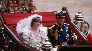 Prince Charles, Prince of Wales and Diana, Princess of Wales, wearing a wedding dress designed by David and Elizabeth Emanuel and the Spencer family Tiara, ride in an open carriage, from St. Paul's Cathedral to Buckingham Palace, following their wedding on July 29, 1981 in London, England. (Photo by Anwar Hussein/Getty Images)