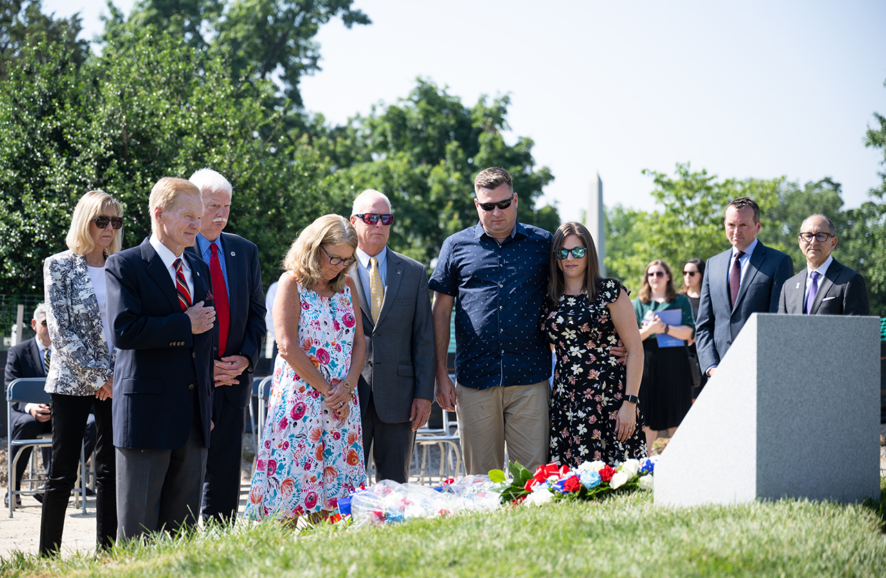 Family members of Apollo 1 astronaut Roger Chaffee are joined by NASA Administrator Bill Nelson during the dedication of the Apollo 1 monument at Arlington National Cemetery.