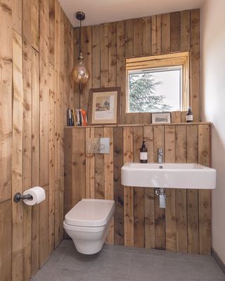 tongue and groove wood panelling in small cloakroom