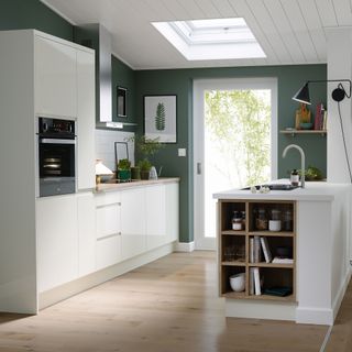 kitchen with green walls and white cabinet