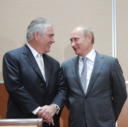 Rex Tillerson shares a smile with Vladimir Putin in 2011.