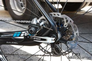 The rear disc brake caliper is neatly tucked away inside the rear triangle. The Shimano disc caliper pictured here is just a placeholder - the production bike will come with a nicer unit.