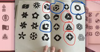 Logo design book with a page open showing several recognisable logo designs circled