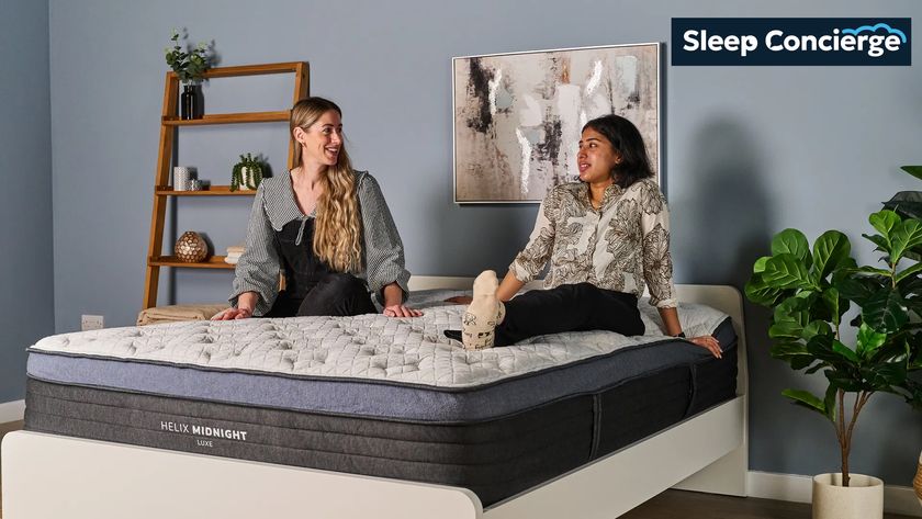 Tom&#039;s Guide Sleep Concierge team image shows two of our mattress testers sitting on a luxury hybrid mattress in our sleep product testing lab