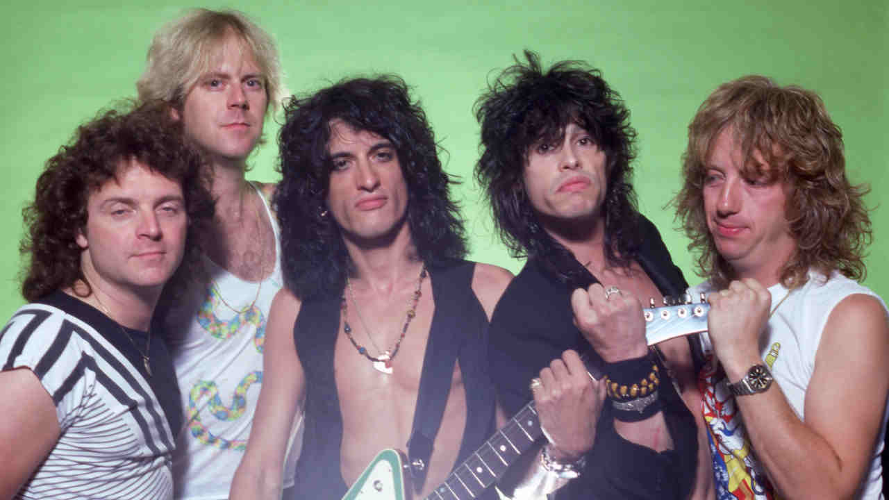 Aerosmith posing for a photograph in the 1980s