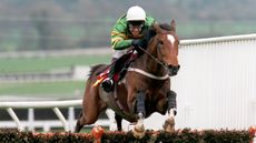 Istabraq ridden by Charlie Swan on the final lap wins the Smurfit Champion hurdle