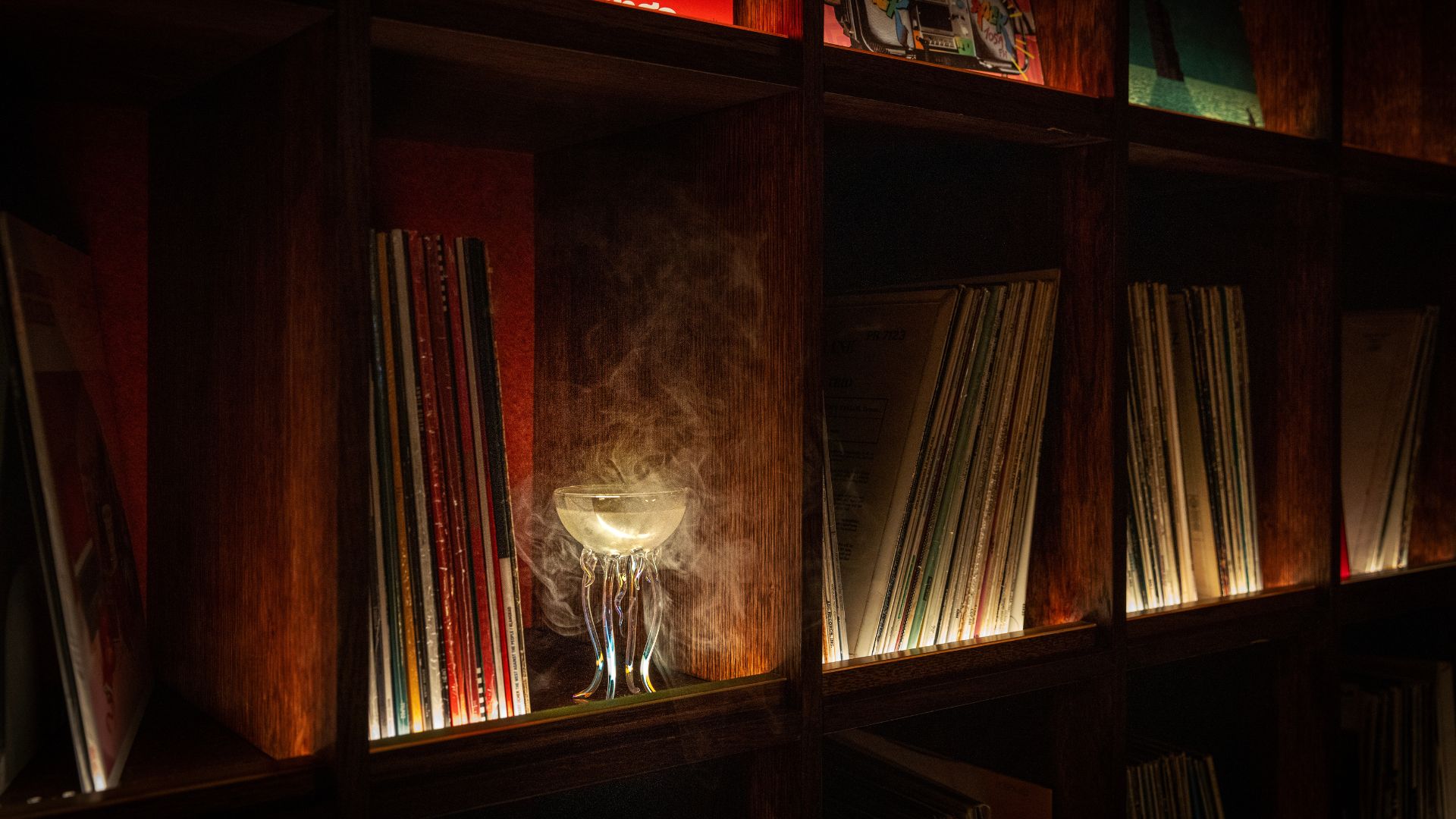 an image of a cocktail from Hidden Grooves in the bookshelf of the vinyl collection