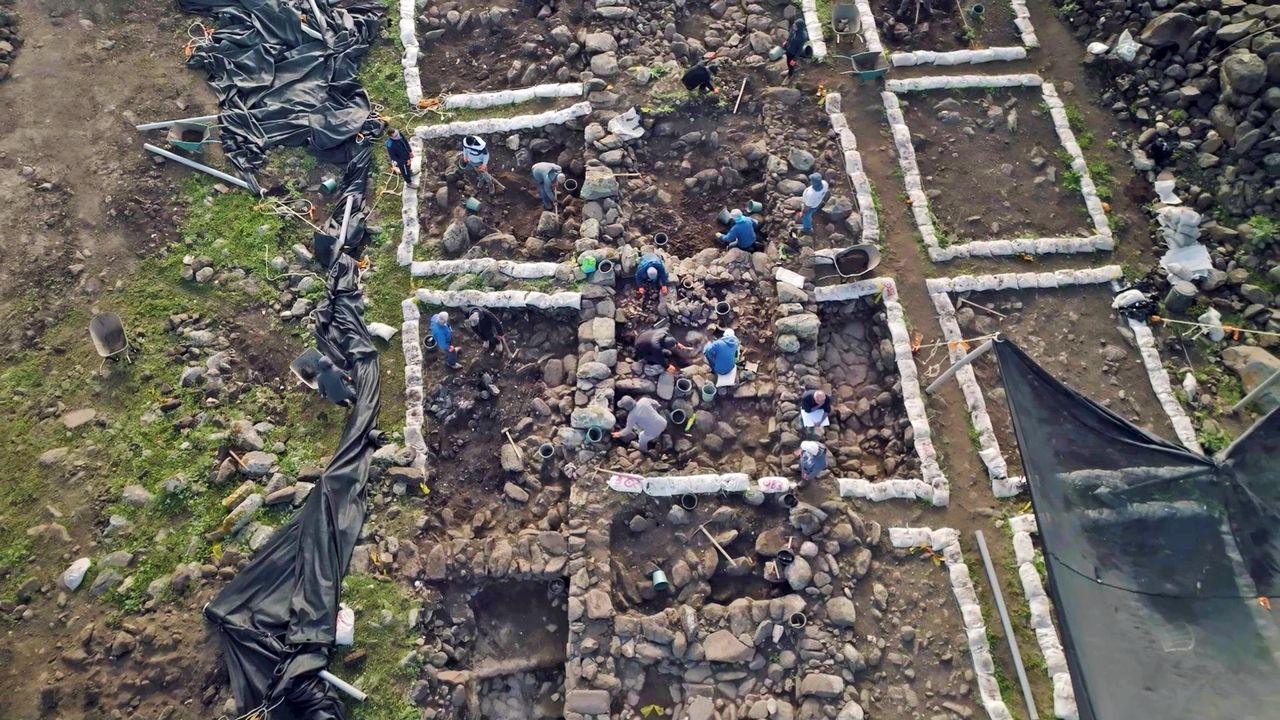 This overhead photo shows archaeologists exploring the ruined foundations of a farmstead that was discovered in northern Israel.