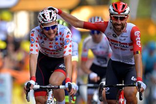 Tim Wellens – in the polka-dot jersey as the 'king of the mountains' leader – and Lotto Soudal teammate Thomas De Gendt share a joke on stage 11 of the 2019 Tour de France 