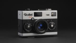 Rollei 35AF film camera on a gray surface and black background