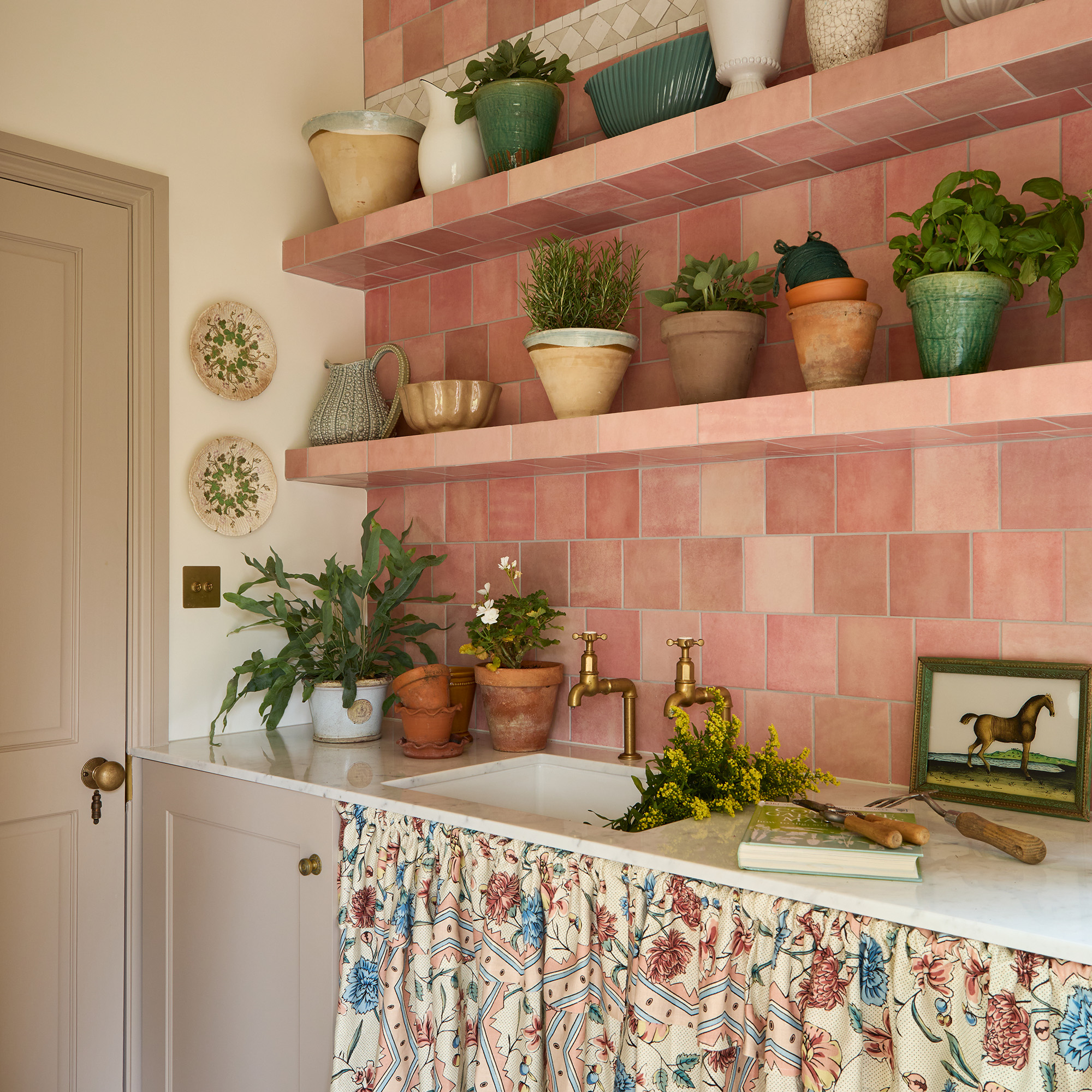 utility with tiled splashback and tiled shelves and sink skirt