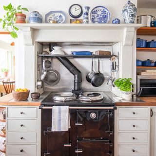 black esse range in a fireplace of a farmhouse kitchen